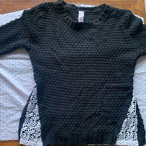 Fitted black sweater with lace detail